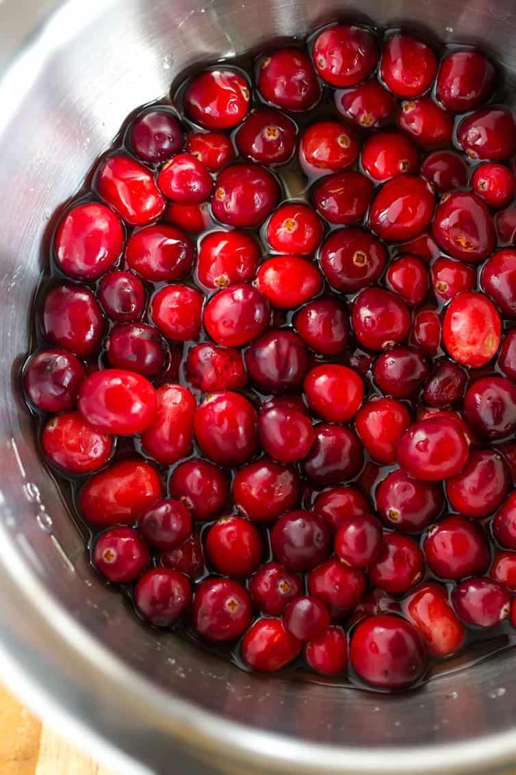An easy recipe for sugared cranberries - a beautiful, sparkly garnish for your holiday desserts and cocktails! | browneyedbaker.com