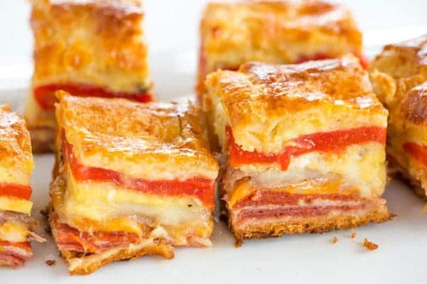 This easy antipasto appetizer bake features layers of Italian meats and cheese, sandwiched between layers of crescent dough. Great for parties!