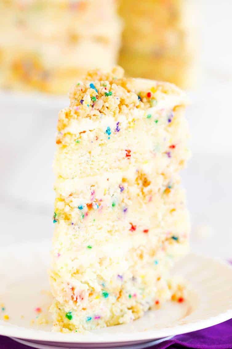 The famous Momofuku Milk Bar Birthday Layer Cake - Layers of funfetti cake loaded with sprinkles, vanilla frosting, and birthday cake crumbs!