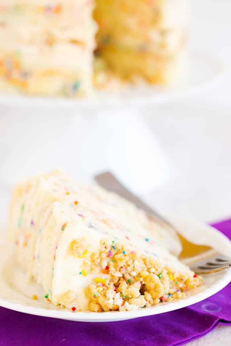 The famous Momofuku Milk Bar Birthday Layer Cake - Layers of funfetti cake loaded with sprinkles, vanilla frosting, and birthday cake crumbs!