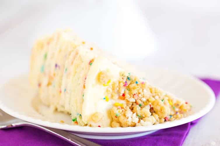 The famous Momofuku Milk Bar Birthday Layer Cake - Layers of funfetti cake loaded with sprinkles, vanilla frosting, and birthday cake crumbs!