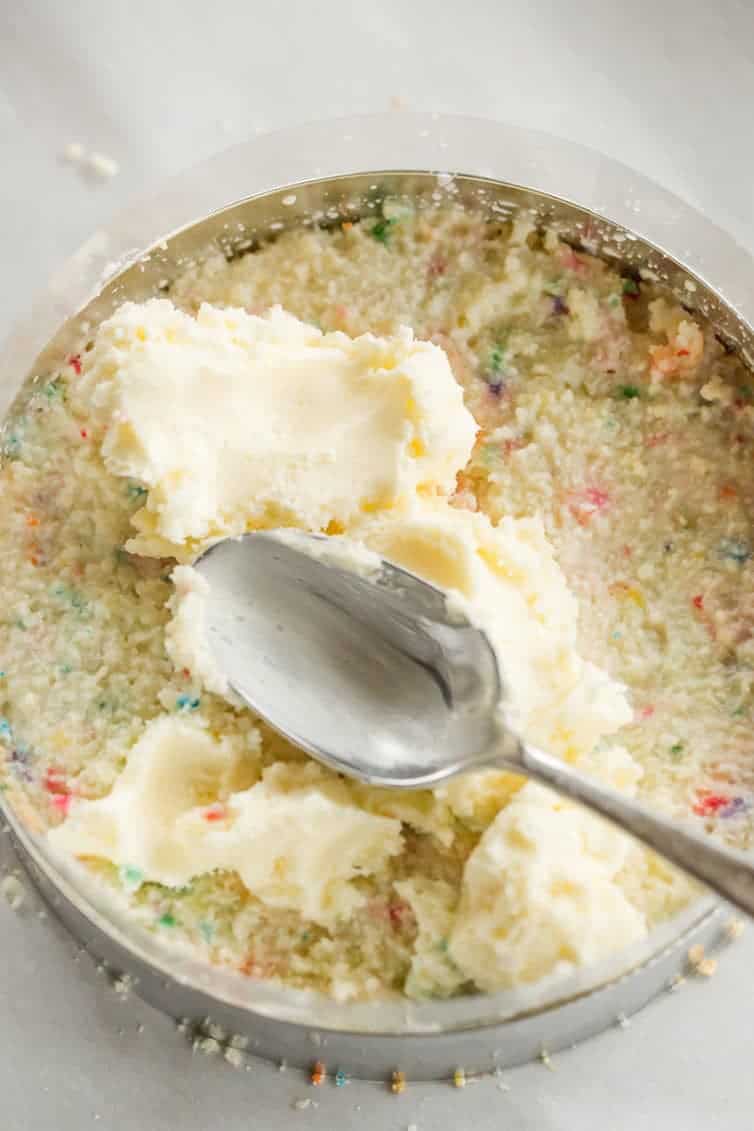 The famous Momofuku Milk Bar Birthday Layer Cake - Layers of funfetti cake loaded with sprinkles, vanilla frosting, and birthday cake crumbs!