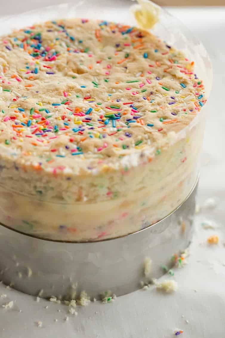 The famous Momofuku Milk Bar Birthday Layer Cake - Layers of funfetti cake loaded with sprinkles, vanilla frosting, and birthday cake crumbs!