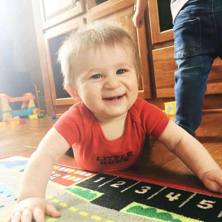 Dominic playing on the floor, trying to crawl!