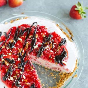 A strawberry-vanilla ice cream pie with a sugar cone and pretzel crust.