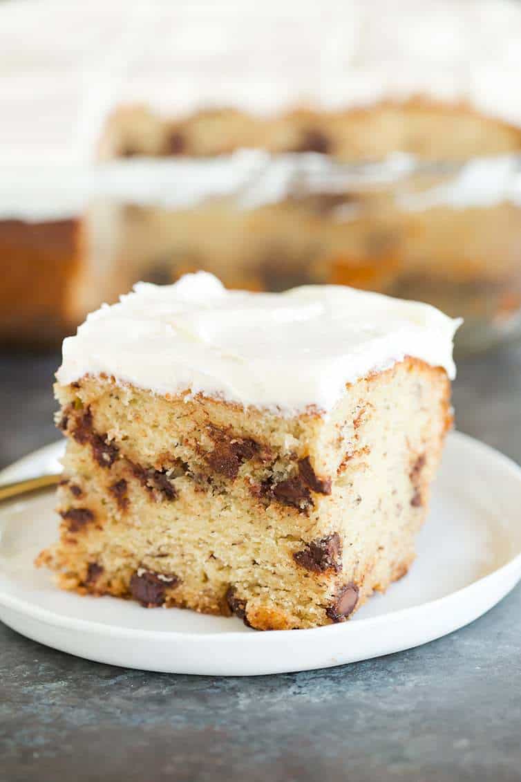 A beautiful slice of Banana-Chocolate Chip Snack Cake slathered with cream cheese frosting.