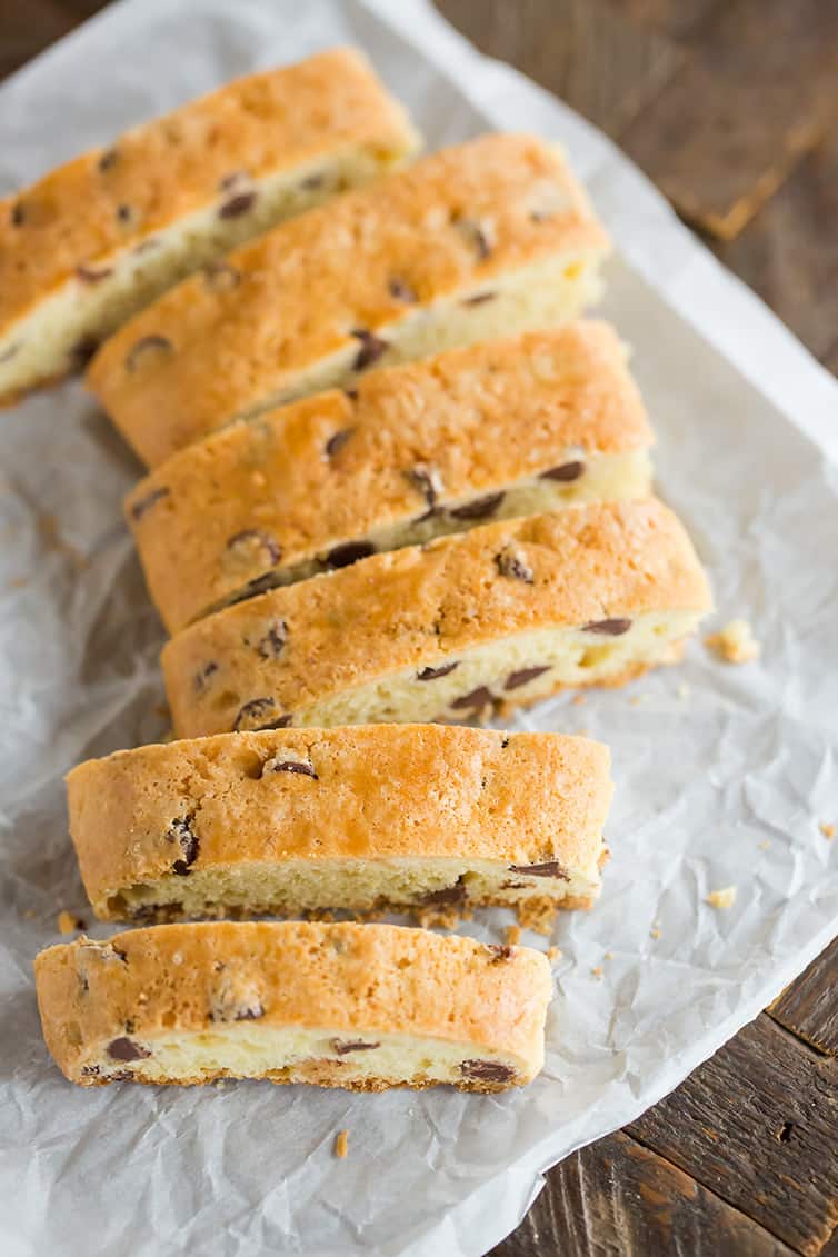Overhead shot of soft biscotti sliced on parchment paper.
