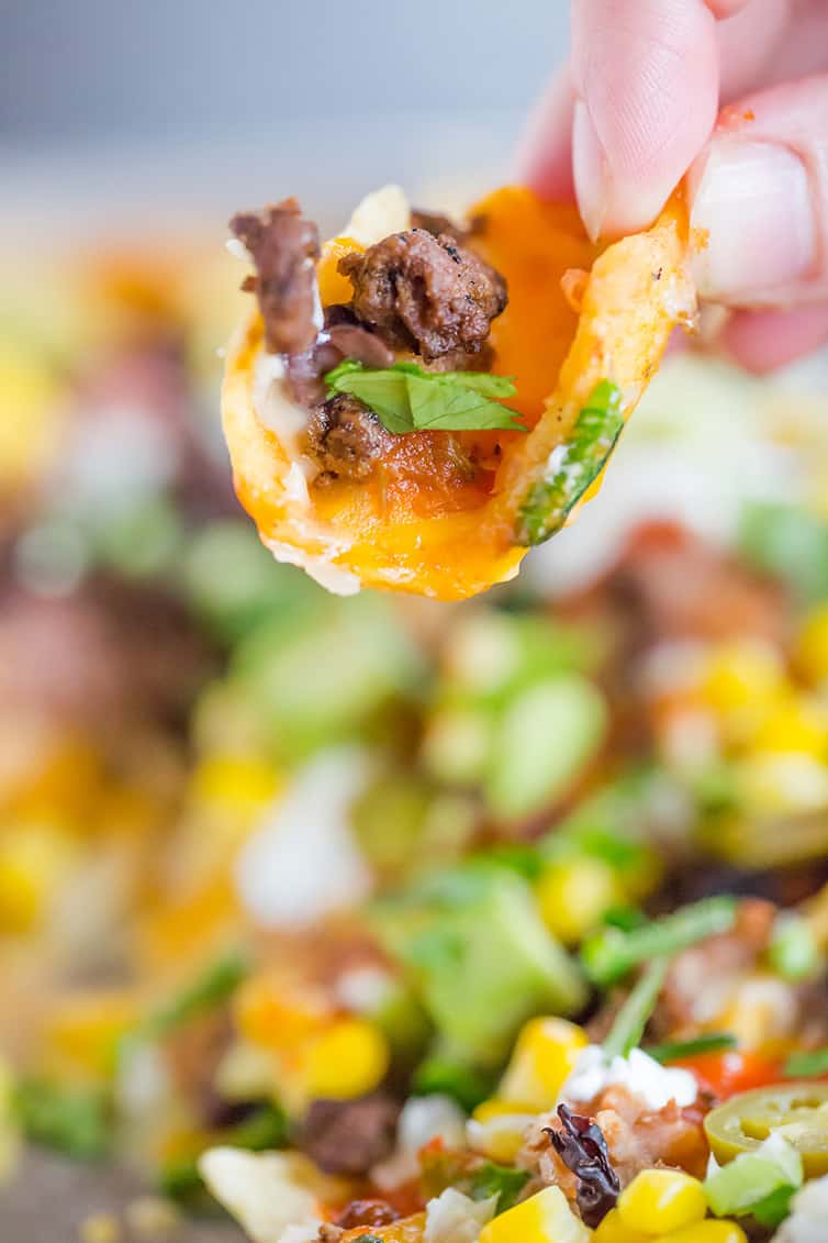 Picking up a Frito Scoop from the nacho tray.