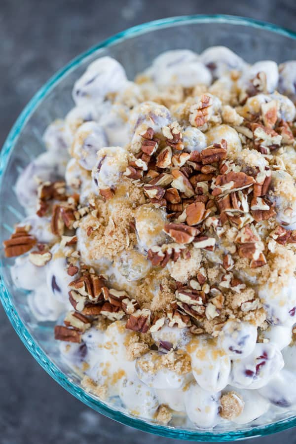 An overhead shot of a bowl of grape salad.