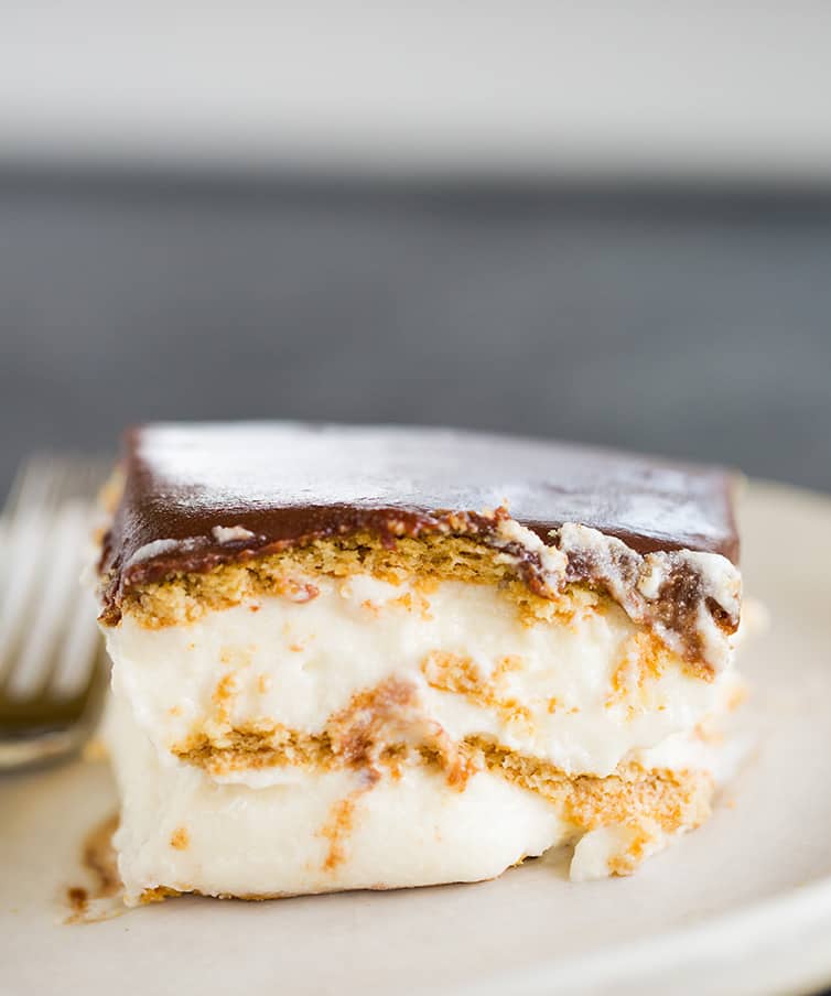 A piece of Chocolate Eclair Cake on a plate.