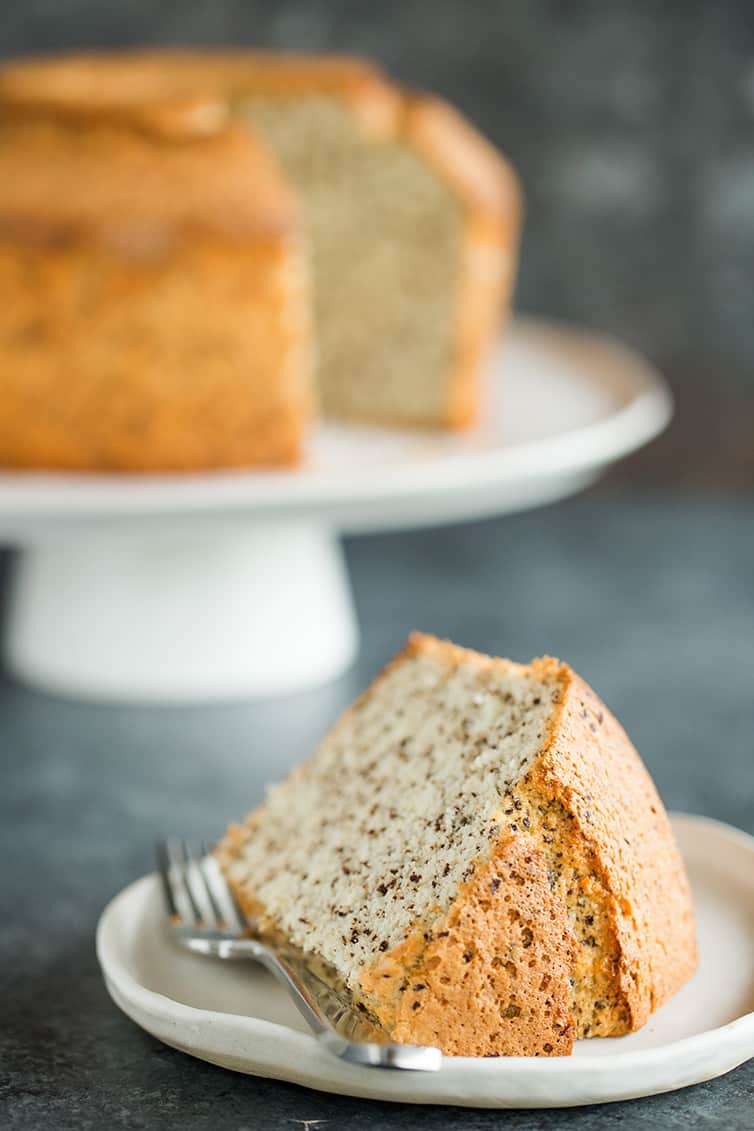 A slice of chocolate chip chiffon cake on its side.