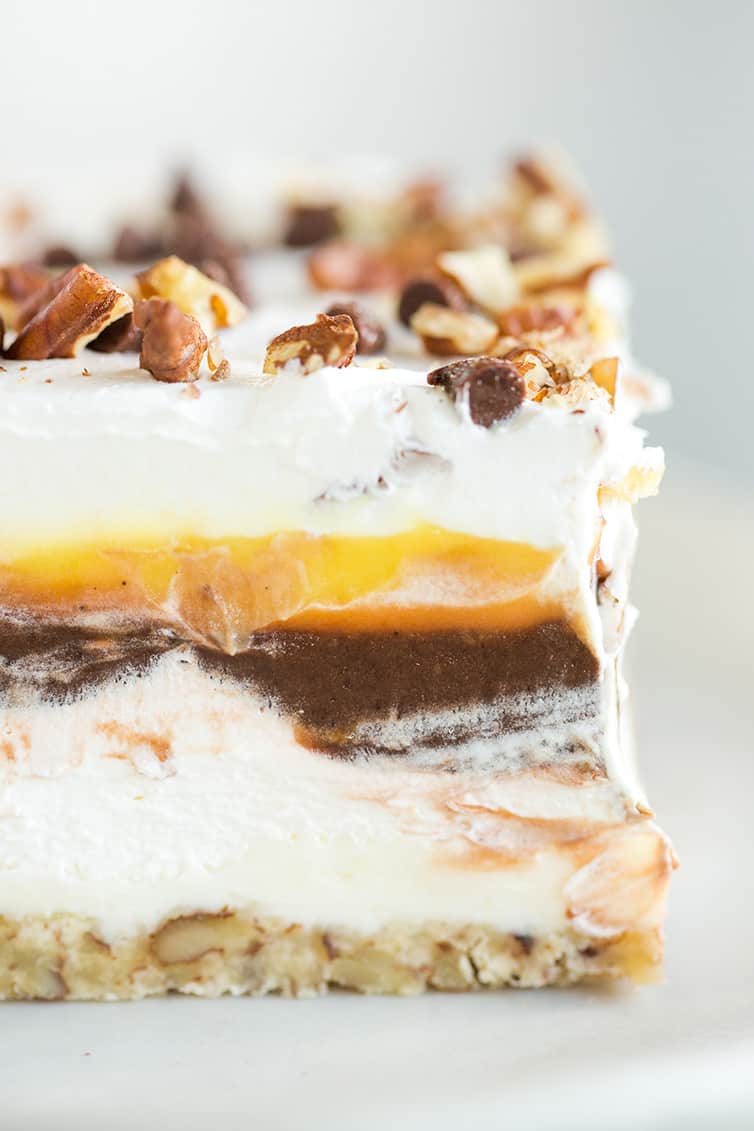 A close up photo of chocolate lush dessert on a plate.