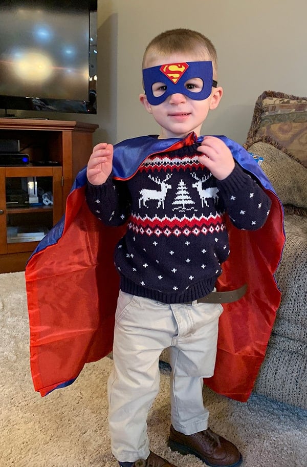 Dominic in a superman cape and mask.