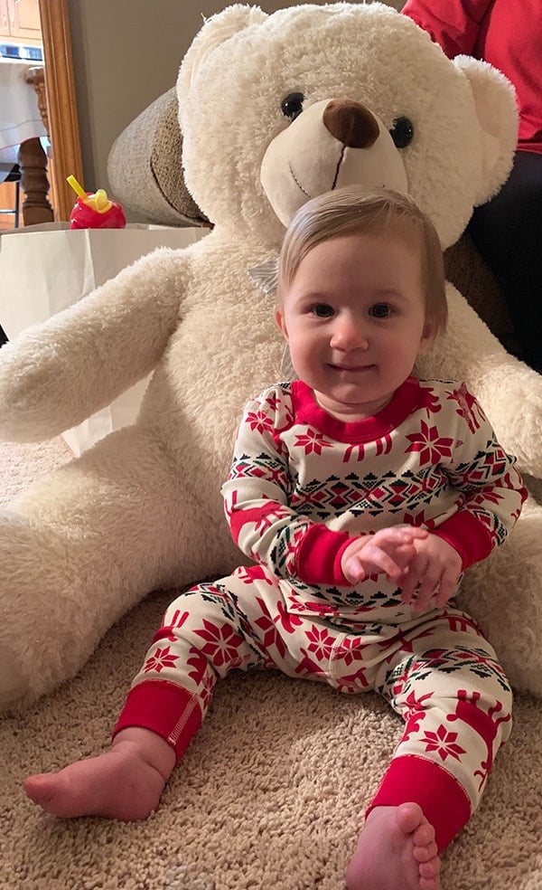 Isabelle with her new life-size teddy bear.