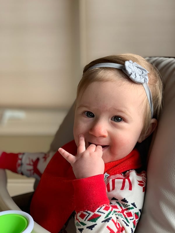 Isabelle in her high chair.