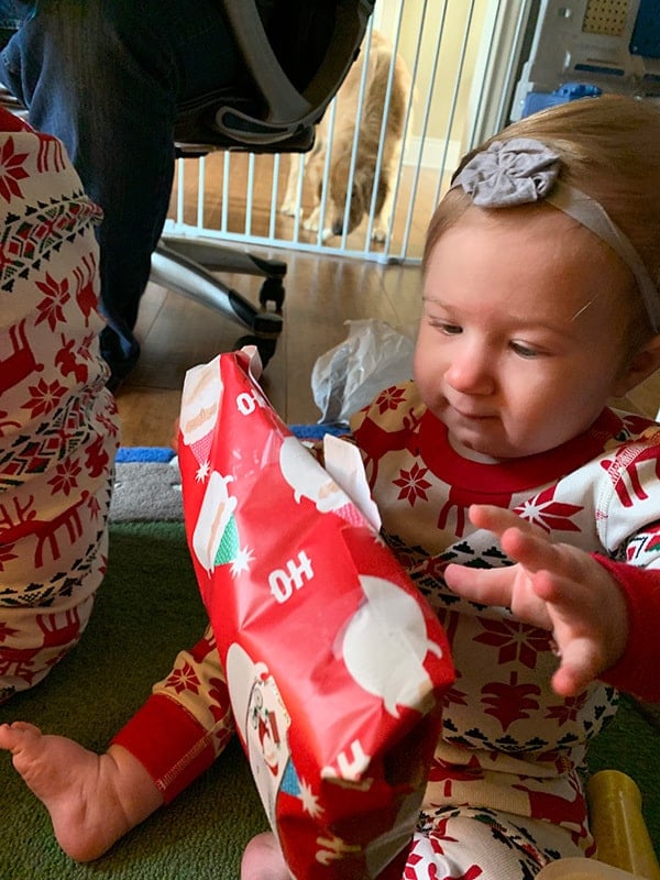 Isabelle opening a present.