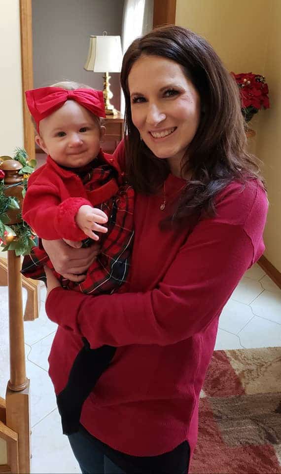 Me holding Isabelle on Christmas Eve