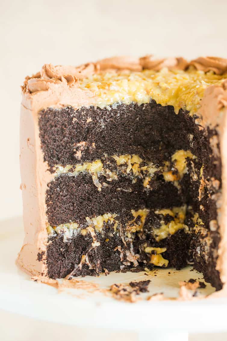 The inside of a German chocolate cake that has had slices removed.