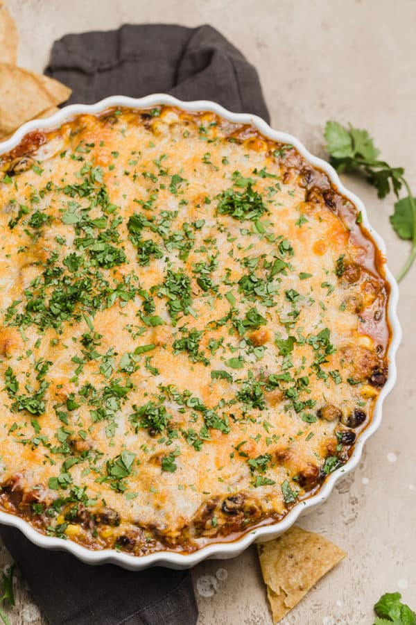 Black bean dip in a shallow white baking dish.