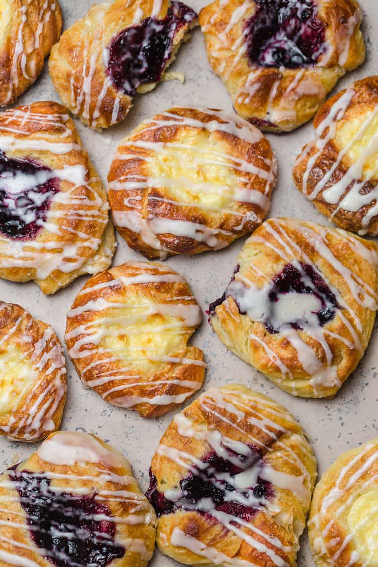 An overhead photo of cheese and fruit danishes.