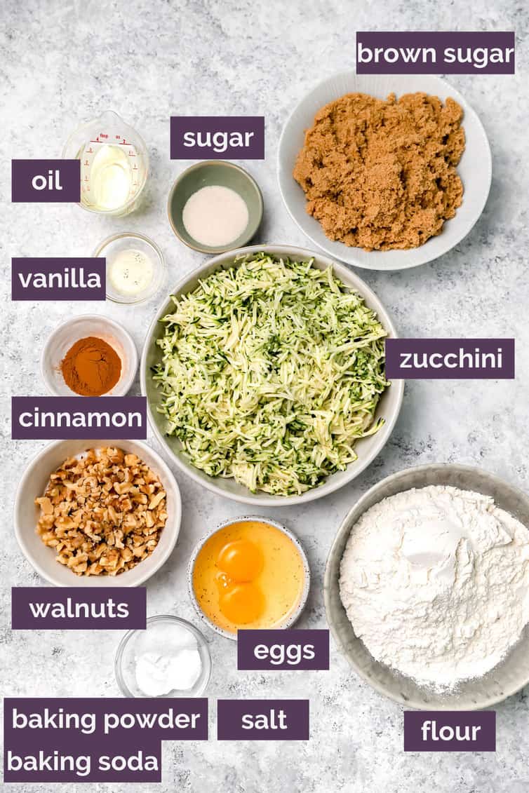Ingredients for zucchini bread prepped in bowls on counter.