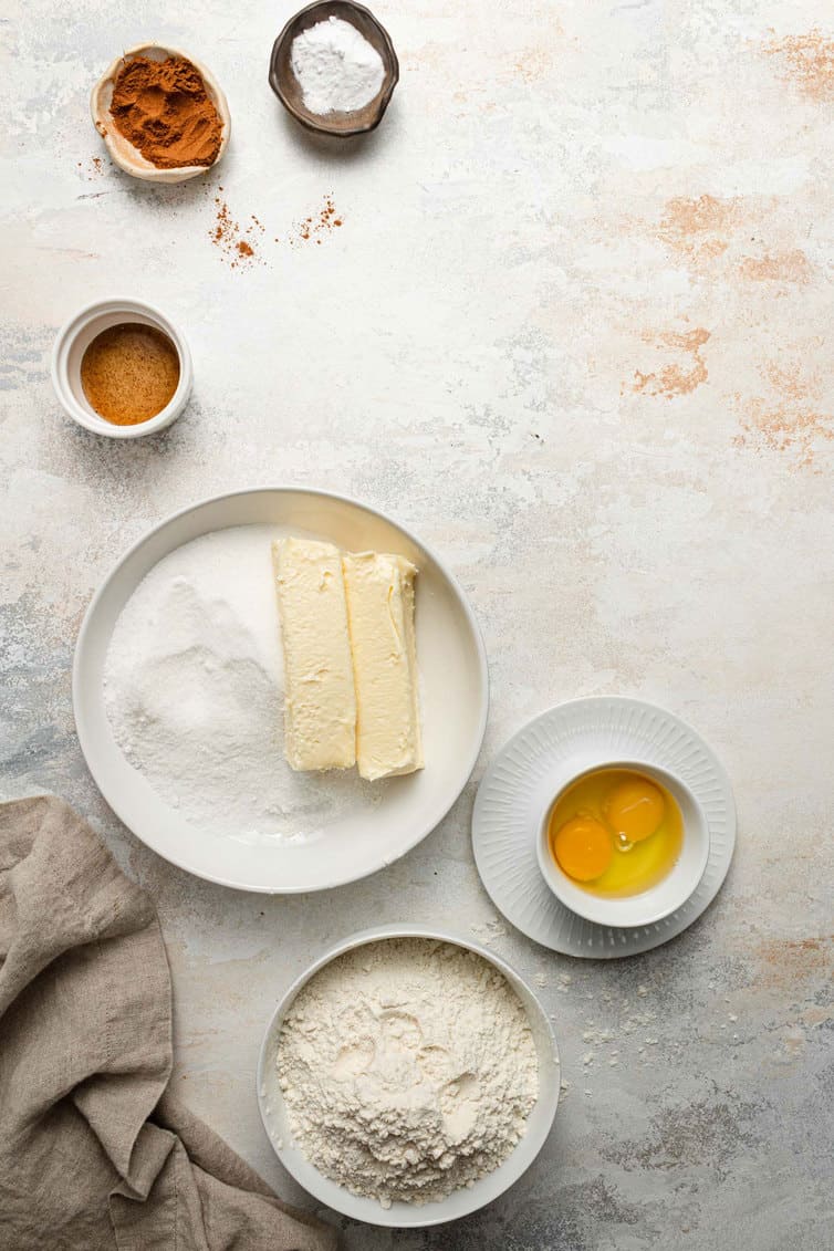 Ingredients for snickerdoodles prepped in bowls on a counter.