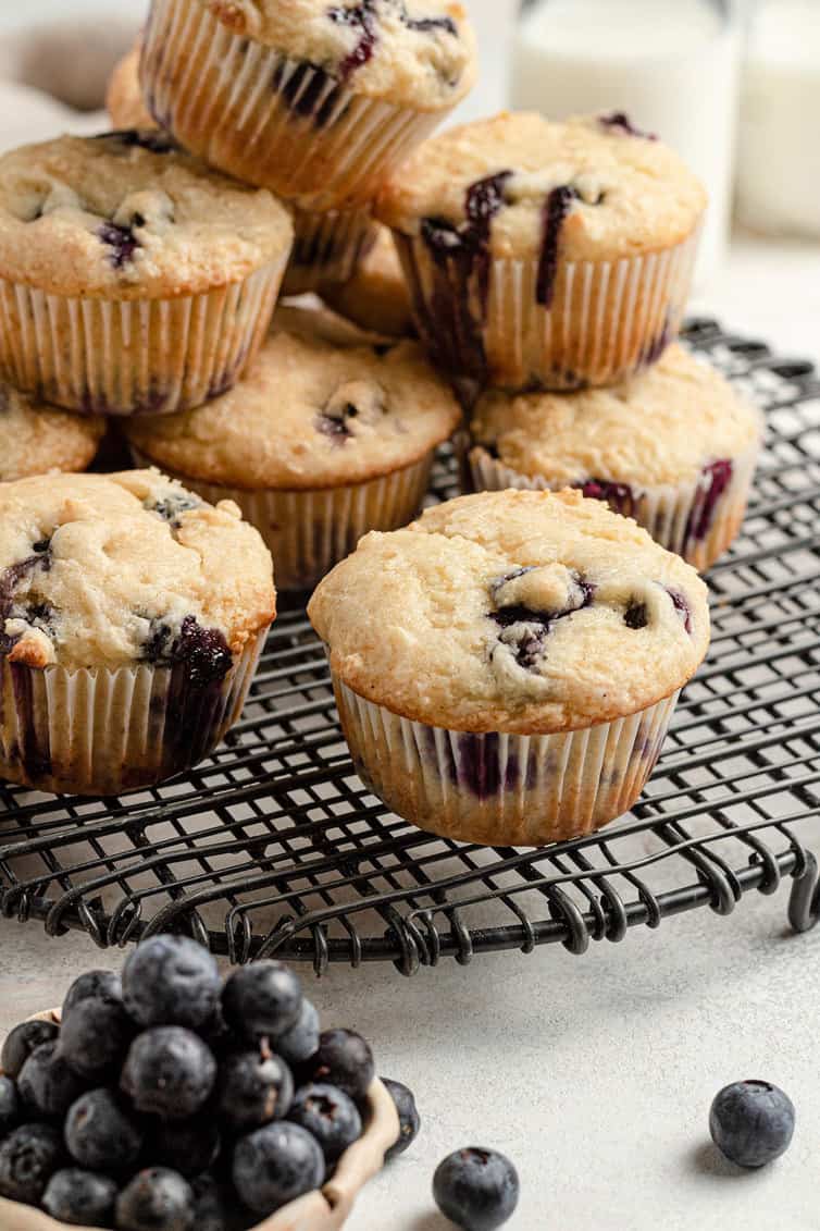 Blueberry muffins on a cooling rack.