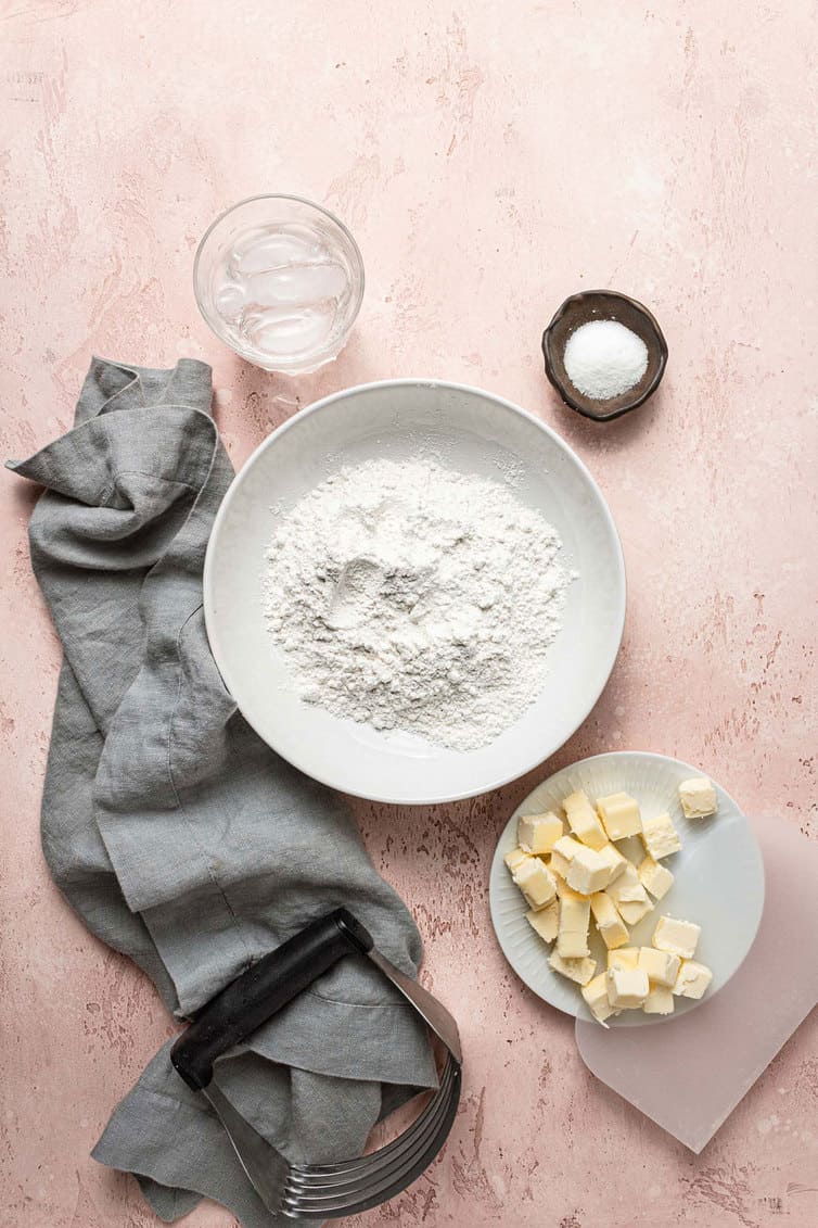 Butter pie crust ingredients prepped in bowls.