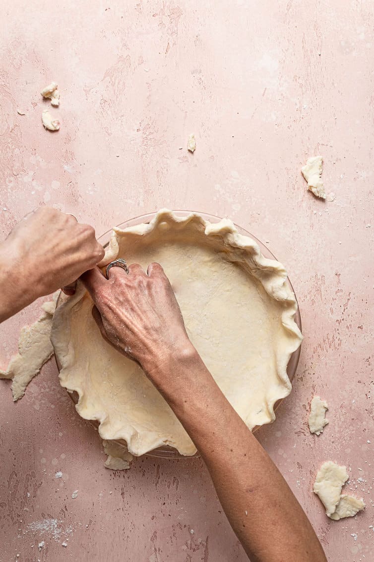 Crimping butter pie crust.