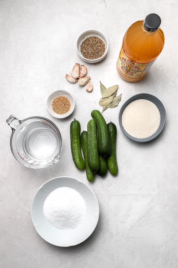 Ingredients for making dill pickles prepped on counter.