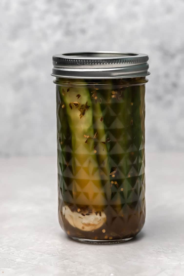 A jar of dill sandwich pickles.