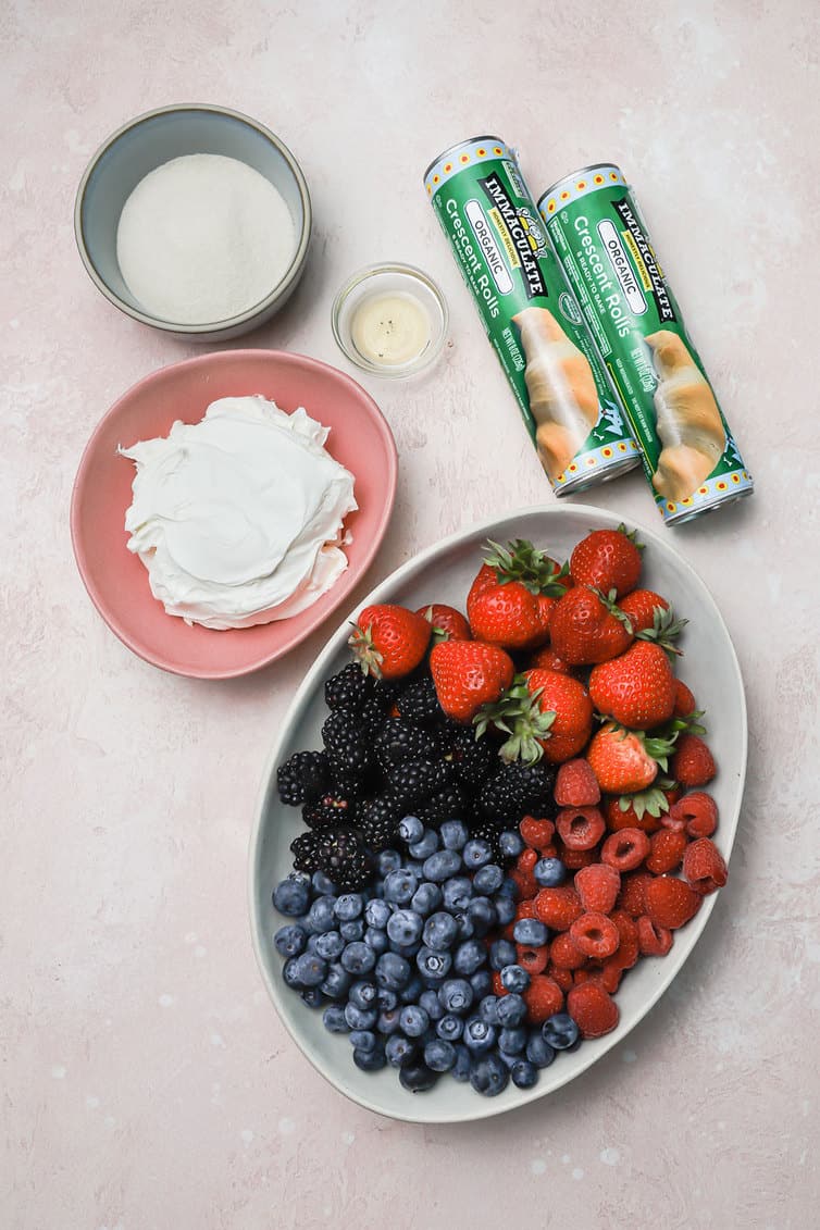 Ingredients for fruit pizza prepped on the counter.