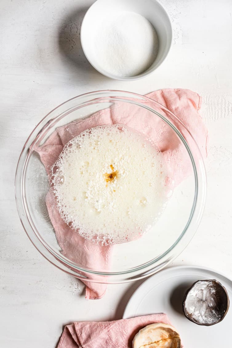 Vanilla added to frothy egg whites.