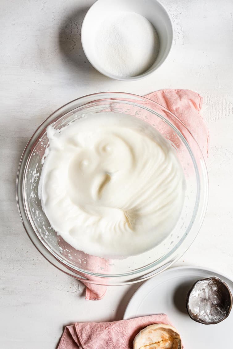 Egg whites whipped to soft peaks.