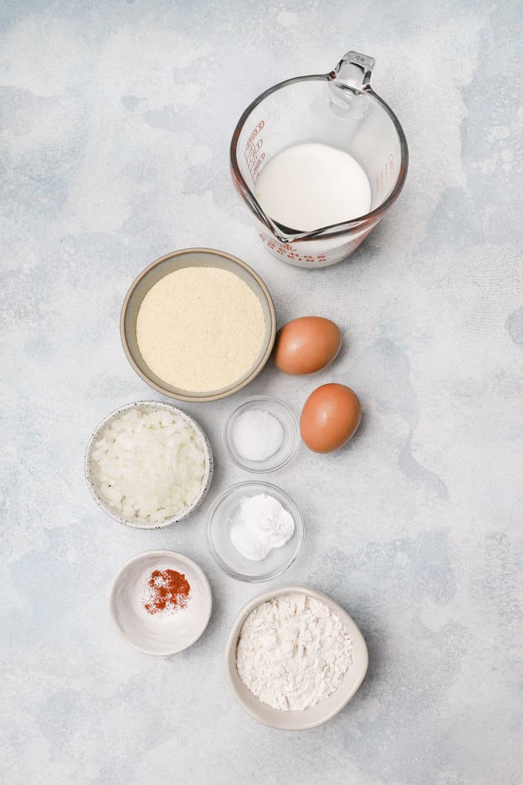 Ingredients for hush puppies prepped in bowls.