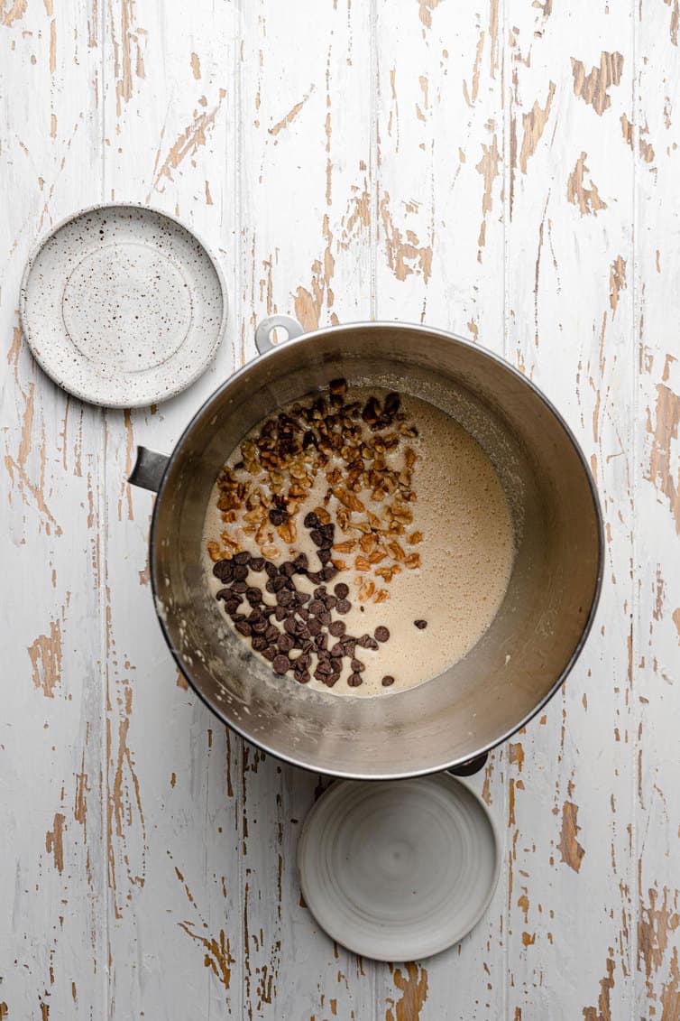 Mixing together derby pie filling in a mixing bowl.