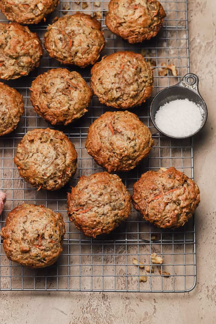 Mornin glory muffins on a wire cooling rack.