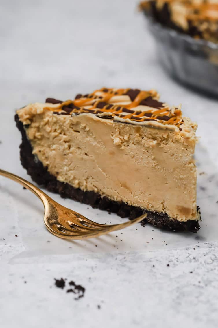 A single slice of peanut butter pie with a fork.