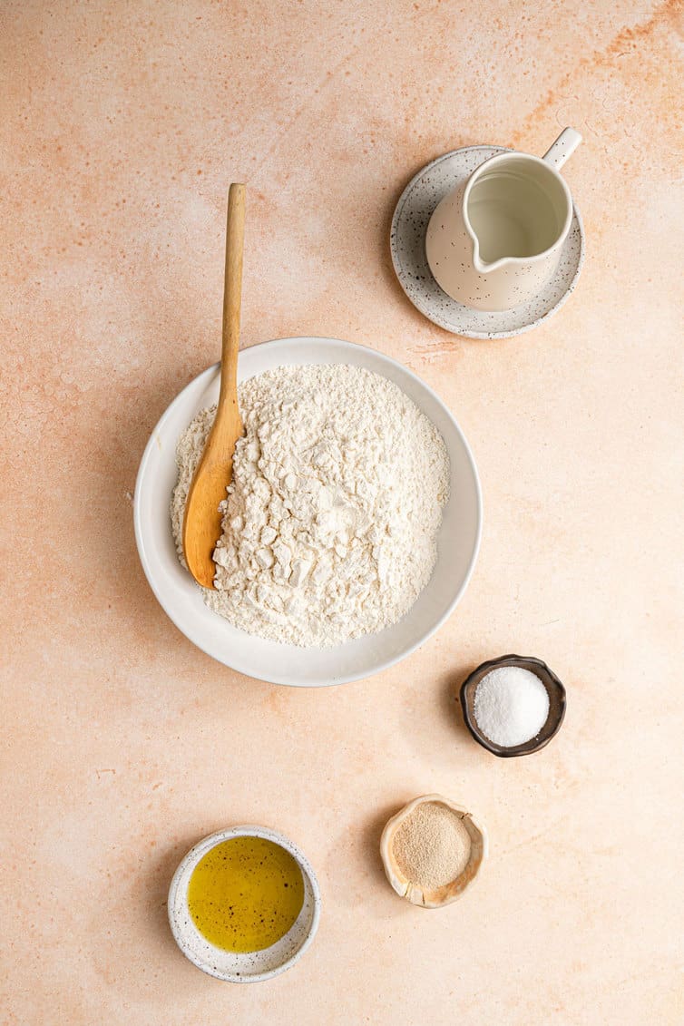 Ingredients for pita bread prepped in bowls.