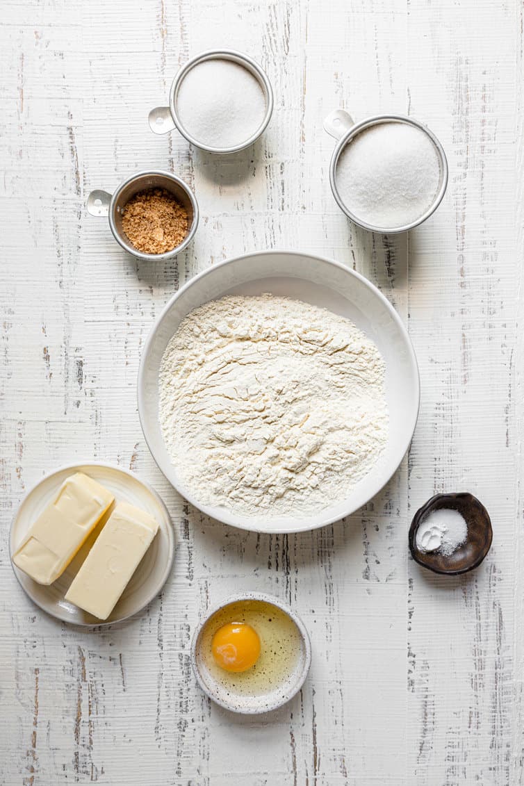Ingredients for sugar cookies prepped in bowls.