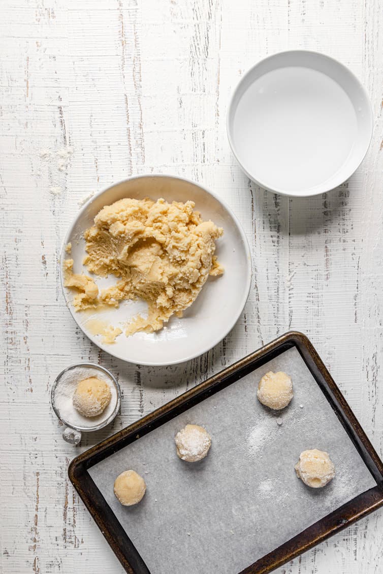 Sugar cookie dough rolled in balls and dipped in sugar