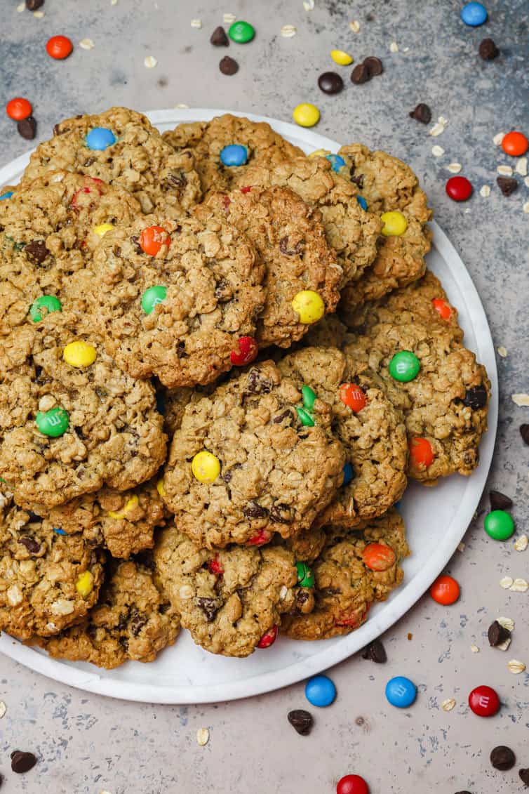 A white plate piled high with monster cookies.