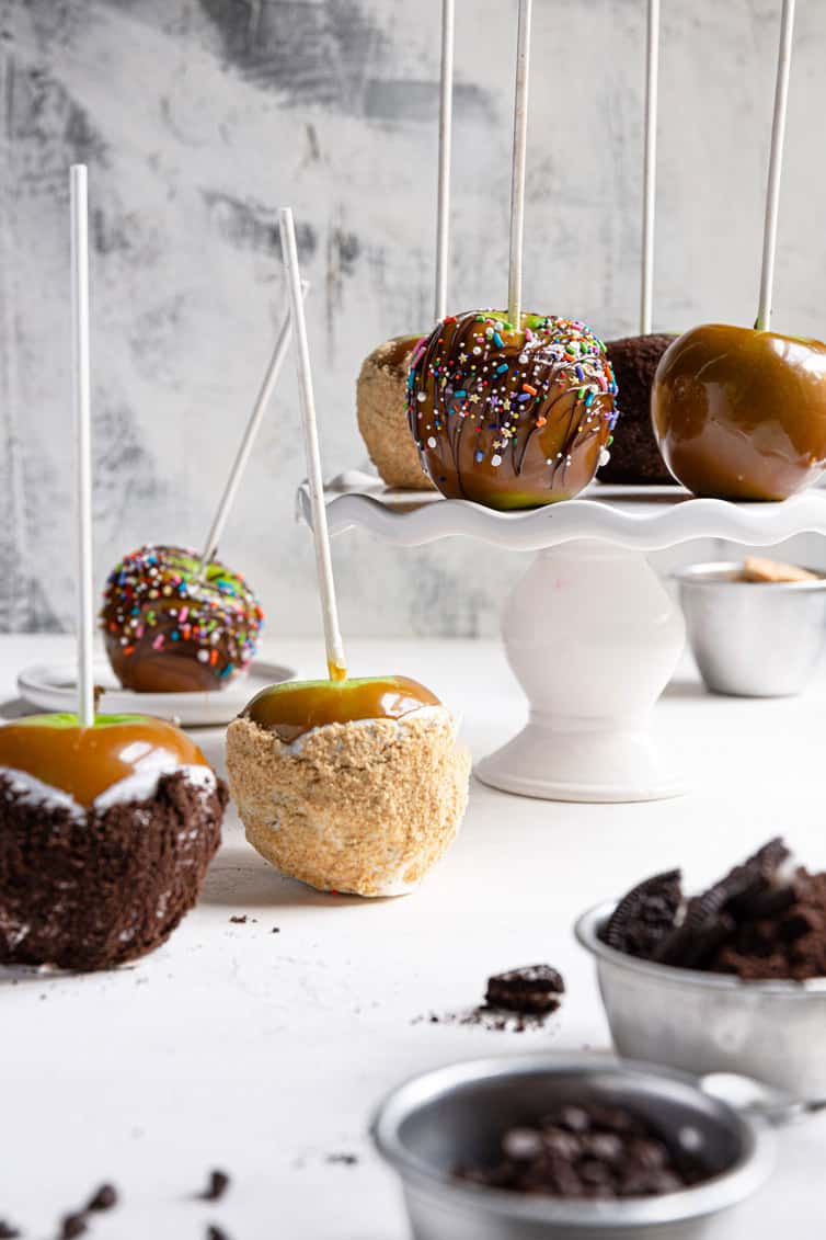 An assortment of decorated homemade caramel apples.