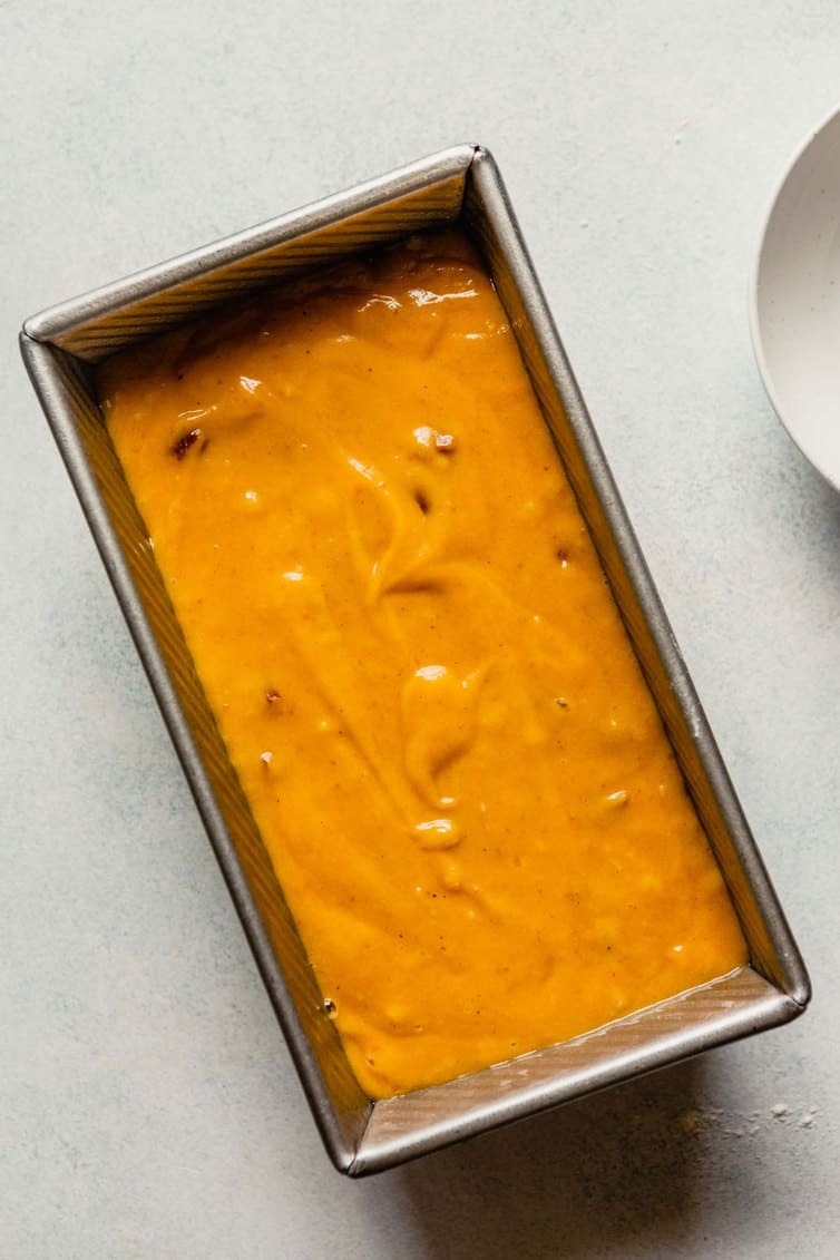 Pumpkin bread batter in loaf pan.