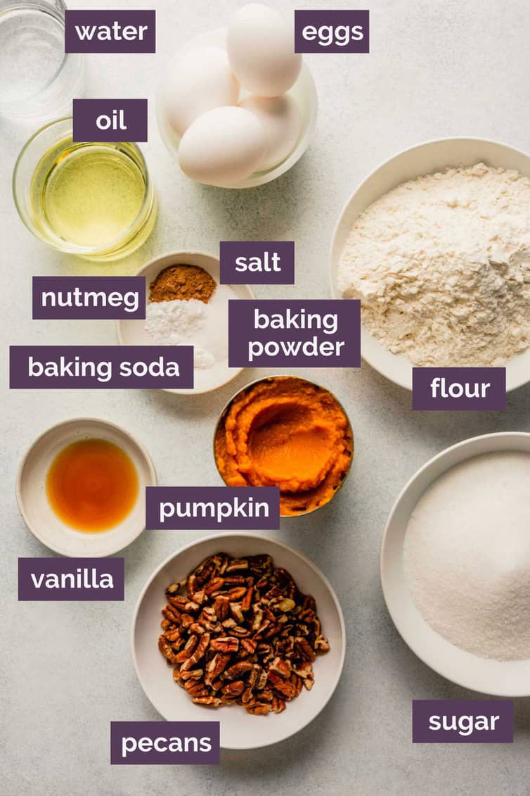 Ingredients for pumpkin bread prepped in bowls and labeled