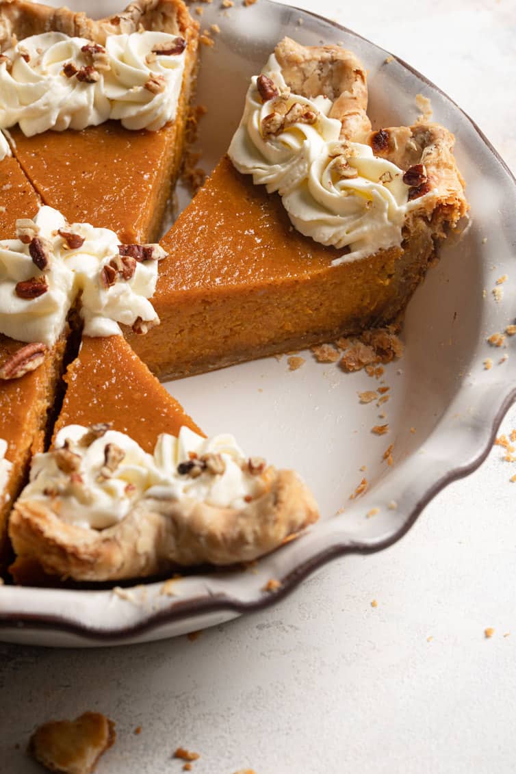 Pie plate with slices of sweet potato pie.