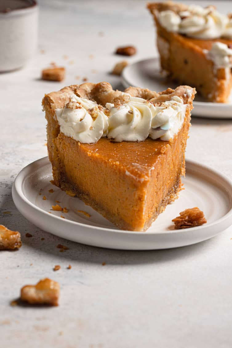 Slice of sweet potato pie on white plate.
