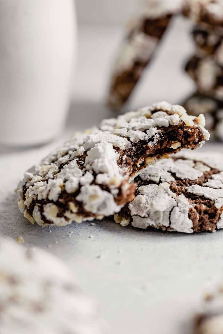 Nutella cookie with a bite taken out resting on another cookie.