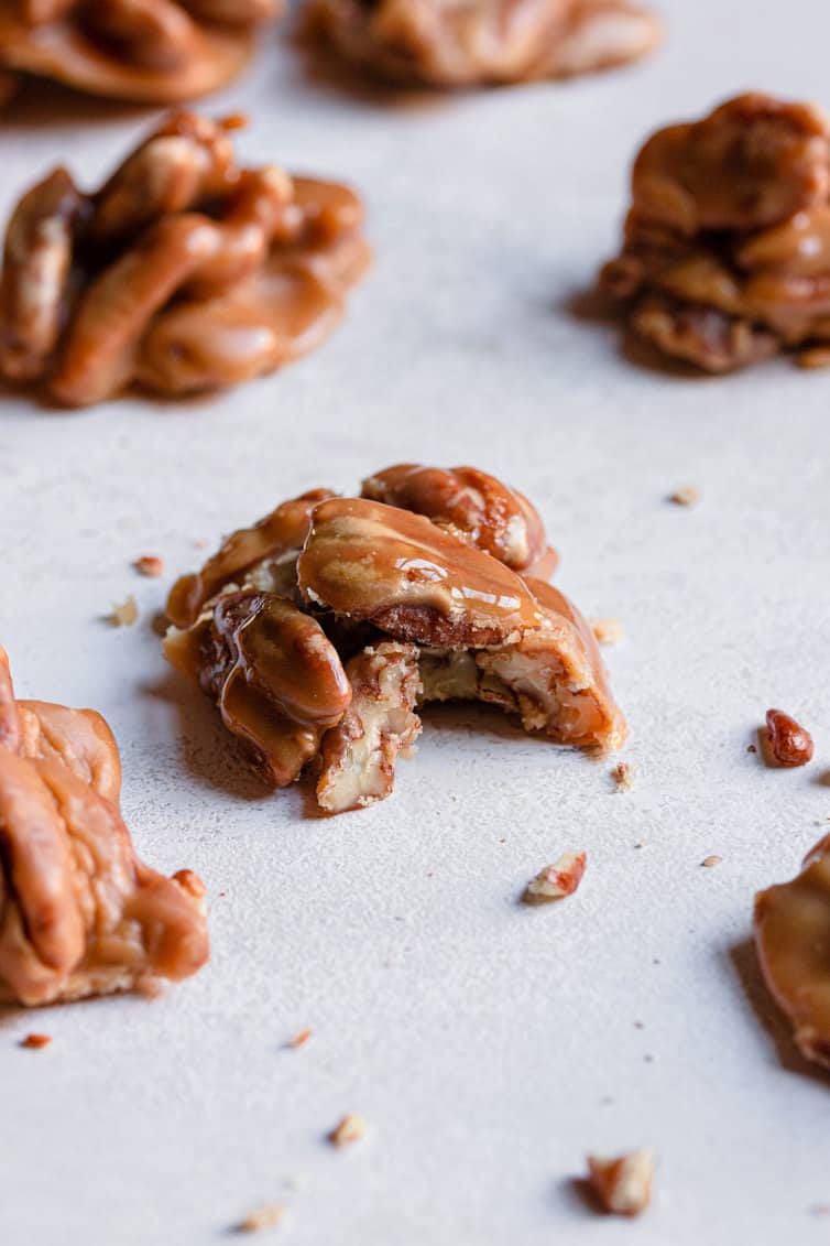 Pecan praline with bite taken out of it.