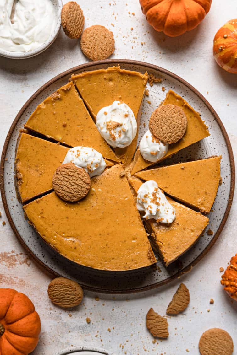 Overhead photo of pumpkin cheesecake sliced into individual pieces.